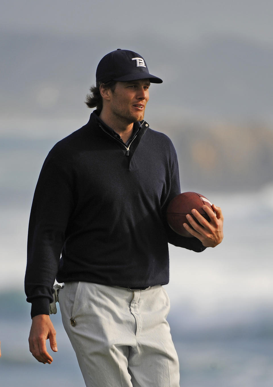 Carrying a football off the 18th green during the third round of the AT&amp;T Pebble Beach National Pro-Am at Pebble Beach Golf Links on Feb. 13, 2010, in Pebble Beach, California.