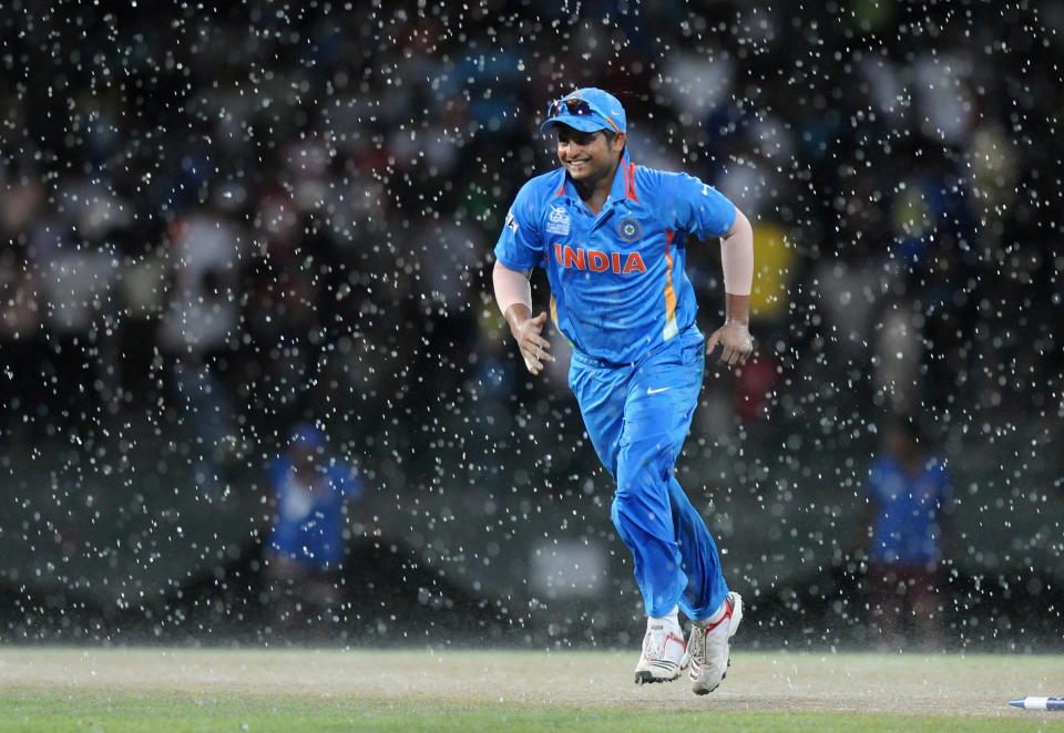 COLOMBO, SRI LANKA - SEPTEMBER 28: Suresh Raina of India runs back to the pavilion as it starts raining during the super eight match between Australia and India held at R. Premadasa Stadium on September 28, 2012 in Colombo, Sri Lanka. (Photo by Pal Pillai/Getty Images)