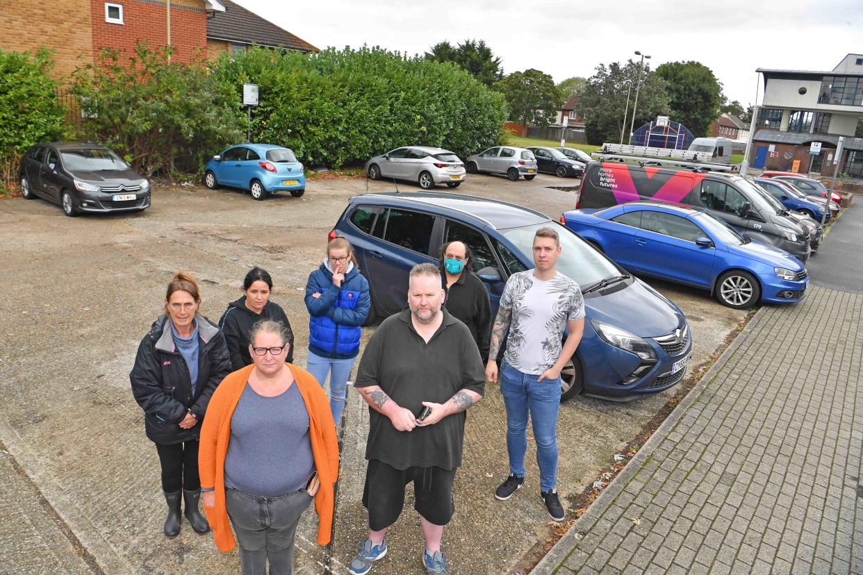 Angry residents of Totland Close, Farnborough, in their car parking area, which was once council owned and free, but has now been taken over by a private firm who intend charging the residents £150 a month to park there. It is one of the county's most deprived areas. (Reach)