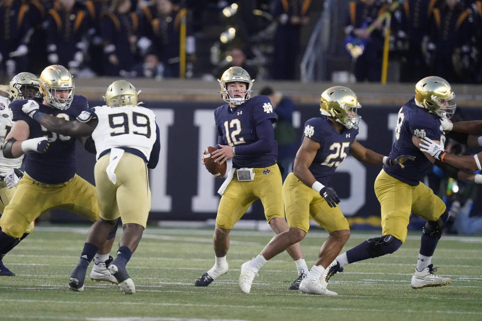 Notre Dame quarterback Tyler Buchner (12) throws during the second half of an NCAA college football game against Georgia Tech, Saturday, Nov. 20, 2021, in South Bend, Ind. Notre Dame won 55-0. (AP Photo/Darron Cummings)