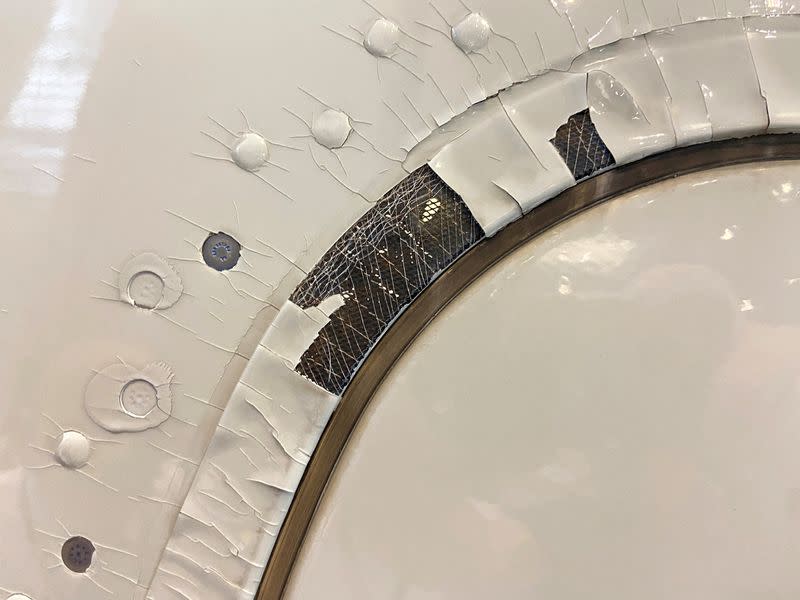 FILE PHOTO: An undated image shows what appears to be paint peeling, cracking and exposed expanded copper foil (ECF) on the window of a Qatar Airways A350 aircraft