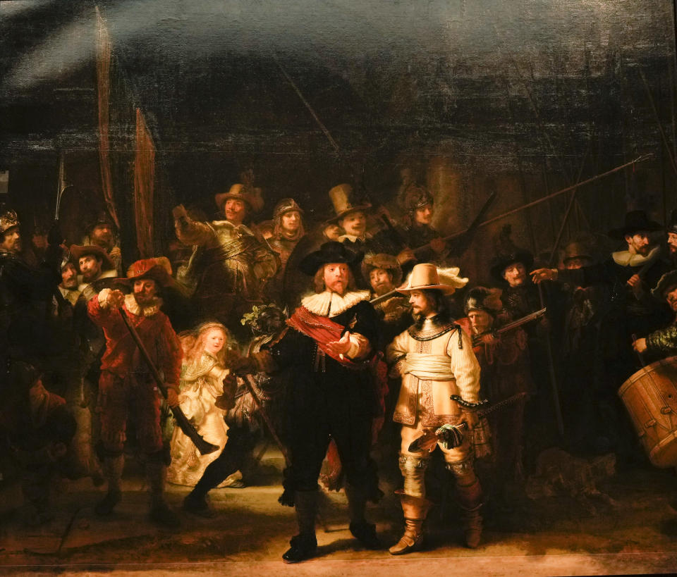 FILE - View of Rembrandt's biggest painting the Night Watch showing the ripple in the painting in the top left corner, in Amsterdam, Netherlands, Wednesday, June 23, 2021. The Netherlands' national museum is planning to re-stretch Rembrandt van Rijn's huge painting "The Night Watch," to get rid of deformations in its top left corner, the Rijksmuseum announced Wednesday, Dec. 8, 2021. (AP Photo/Peter Dejong, File)