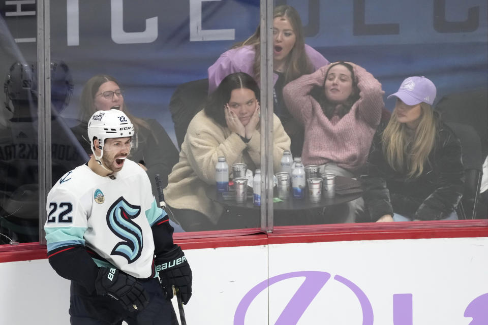 Seattle Kraken right wing Oliver Bjorkstrand celebrates after scoring the go-ahead goal against the Colorado Avalanche as fans react during the third period of an NHL hockey game Thursday, Nov. 9, 2023, in Denver. (AP Photo/David Zalubowski)