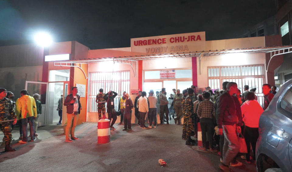 This videograb shows people outside the HJRA (Hopital Joseph Ravoahangy Andrianavalona) public hospital emergency building in Antananarivo on August 25, 2023 following a stampede at a stadium. At least 13 people, including seven children, were killed Friday in a crowd stampede at a stadium in the Madagascar capital of Antananarivo, according to the Red Cross and a local member of parliament. (Photo by AFP) (Photo by -/AFP via Getty Images)