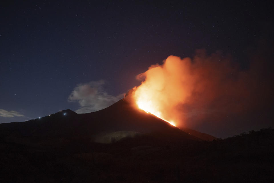 Pacaya volcano spews lava, viewed from San Vicente Pacaya, Guatemala, Wednesday, March 3, 2021. (AP Photo/Santiago Billy )