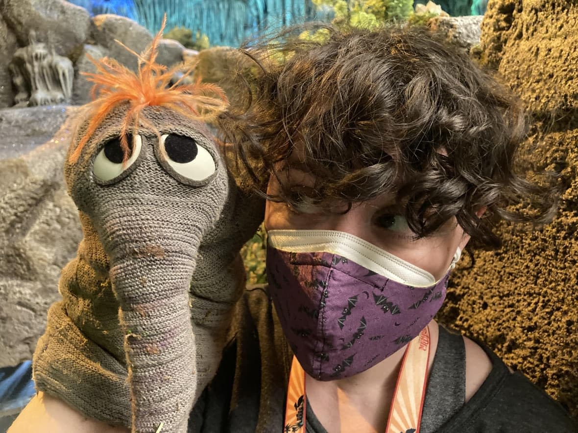 Kira Hall with one of the background cave creatures, a puppet used in the original Fraggle Rock series in the '80s.  (Submitted by Kira Hall - image credit)