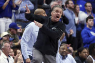 Kentucky head coach John Calipari gestures during the second half of the team's NCAA college basketball game against Kansas in Lexington, Ky., Saturday, Jan. 28, 2023. Kansas won 77-68. (AP Photo/James Crisp)