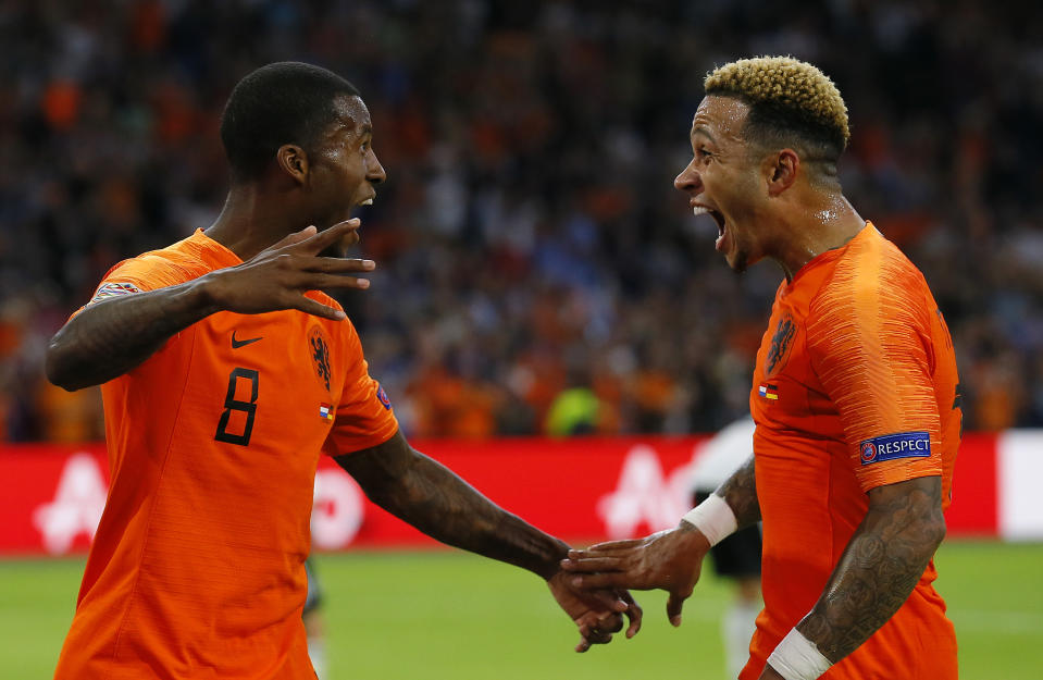 Netherland's scorer Georginio Wijnaldum, left, celebrates after he scored his side's third goal with Netherland's second scorer Memphis Depay, right, during the UEFA Nations League soccer match between The Netherlands and Germany at the Johan Cruyff ArenA in Amsterdam, Saturday, Oct. 13, 2018. The Netherlands defeated Germany with 3-0. (AP Photo/Peter Dejong)