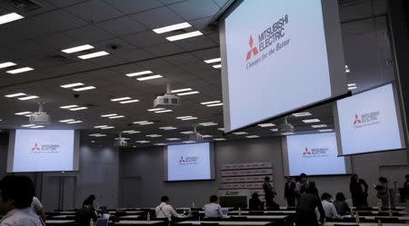 FILE PHOTO: Logos of Mitsubishi Electric Corp are seen at a news conference at the company's headquarters in Tokyo, Japan, May 23, 2016. REUTERS/Toru Hanai/File Photo