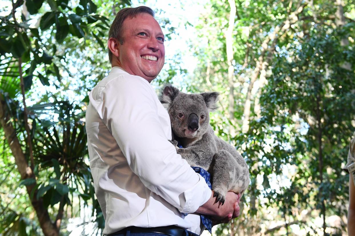 <span>Queensland premier Steven Miles cuddles a koala during a visit to Lone Pine Koala Sanctuary in 2023. The wildlife park this week banned the practice. </span><span>Photograph: Jono Searle/AAP</span>