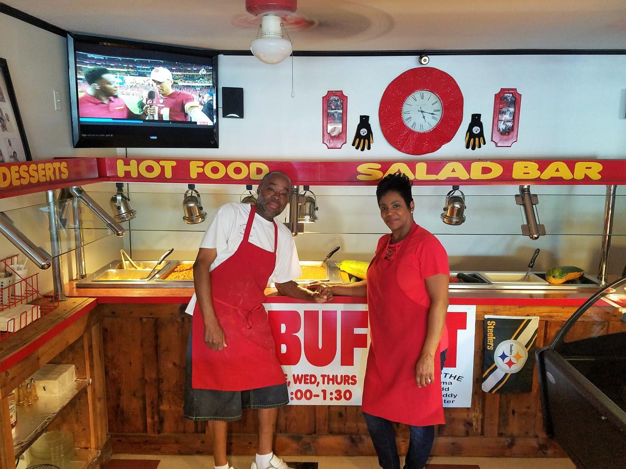 Manager Jody Stott, left, and owner Karen Rupert, right, at the popular new Southern catfish buffet at Mama's Pizza and More in Henderson.