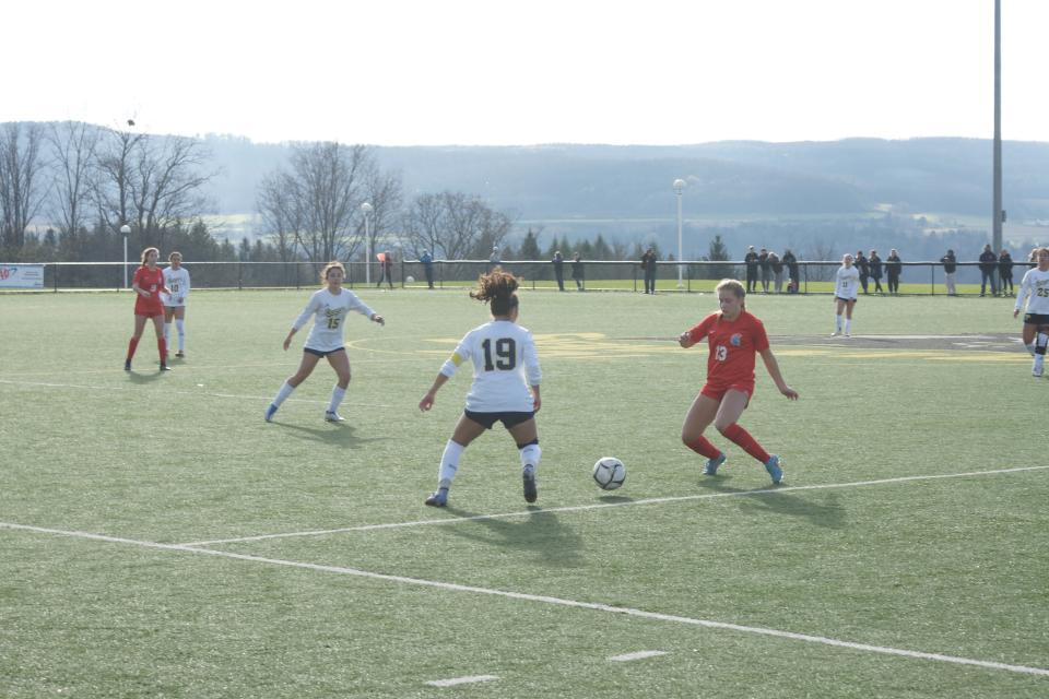 New Hartford Senior Willa Pratt and Spencerport Junior Aleena Solano battle for possession in the Class A Girls Soccer State Semifinal on November 12, 2022, in Cortland, NY. The Spartans defeated the Rangers 1-1 (6-5) in Penalty Kicks.