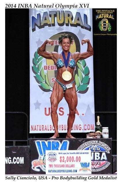 Sally Cianciolo, the first saleswoman for Heraeus Electro-Nite in Hartland, also competed in bodybuilding. She is pictured as she won the National Olympia for Bodybuilding in 2014.