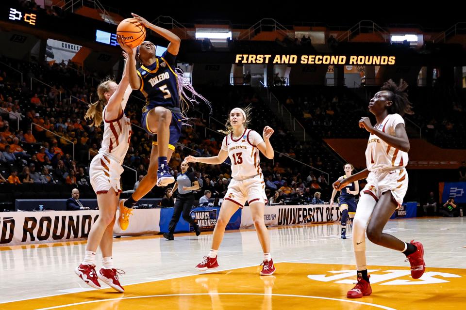 Toledo guard Quinesha Lockett (5) shoots past Iowa State guard Ashley Joens, left, in the first half of a first-round college basketball game in the NCAA Tournament, Saturday, March 18, 2023, in Knoxville, Tenn.