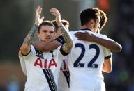 Football Soccer - Colchester United v Tottenham Hotspur - FA Cup Fourth Round - Weston Homes Community Stadium - 30/1/16 Tottenham's Nacer Chadli celebrates with Kieran Trippier (L) after scoring their third goal Reuters / Dylan Martinez Livepic