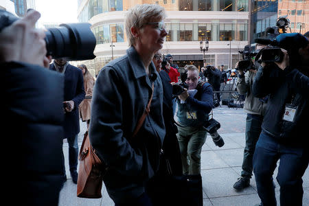 Donna Heinel, former associate athletic director at the University of Southern California (USC) facing charges in a nationwide college admissions cheating scheme, arrives at the federal courthouse in Boston, Massachusetts, U.S., March 25, 2019. REUTERS/Brian Snyder