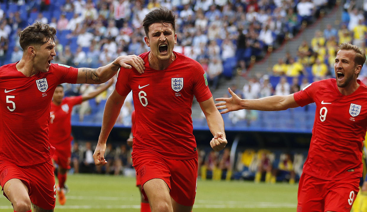 Harry Maguire celebrates after putting England ahead against Sweden