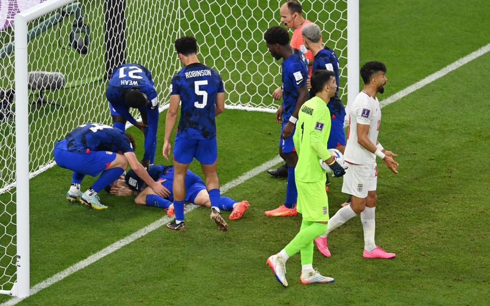 Christian Pulisic of United States reacts after scoring their first goal during the FIFA World Cup Qatar 2022 Group B match between IR Iran and USA - Claudio Villa/Getty Images