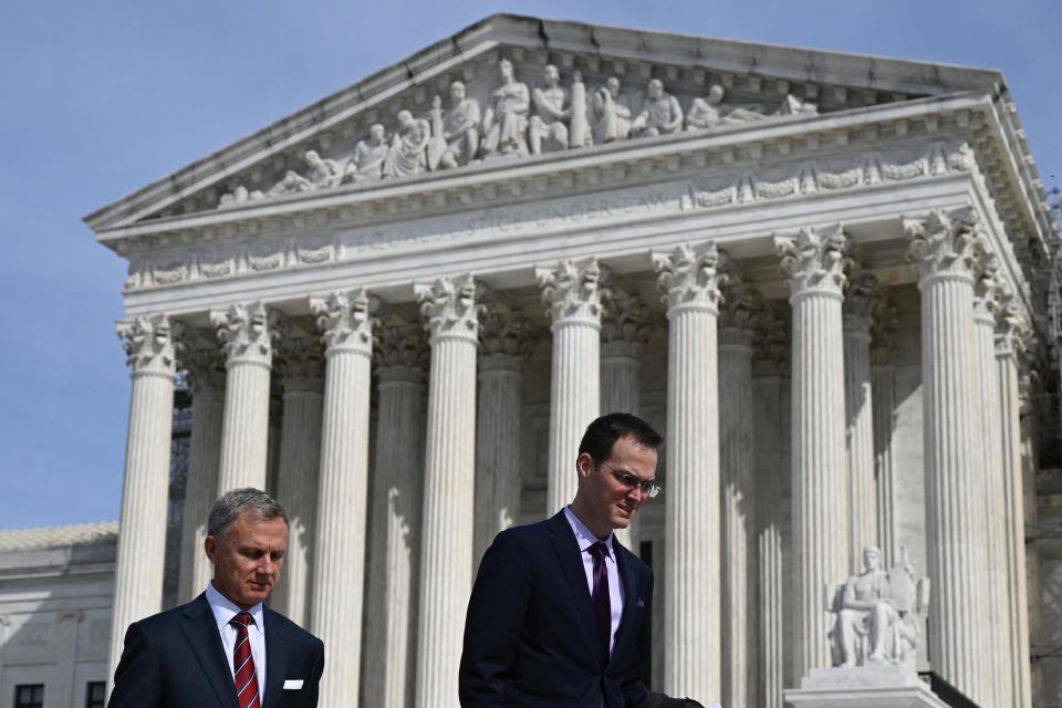 Matt Schruers, right, president of the Computer & Communications Industry Association, leaves the U.S. Supreme Court after Monday's arguments.