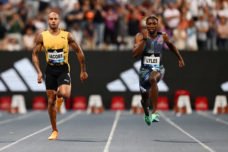 USA's Noah Lyles  (R) runs to first place  ahead of Italy's Lamont Marcell Jacobs in the men's 100m event during the IAAF Diamond League 