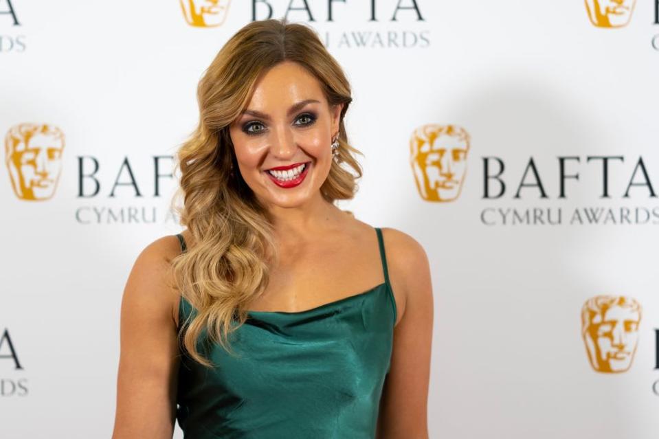 Amy Dowden looks glamorous in emerald green gown