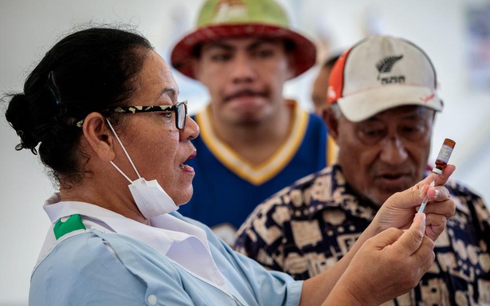 Nurses administer the measles vaccine at a Red Cross in Apia, Samoa - Jack Taylor