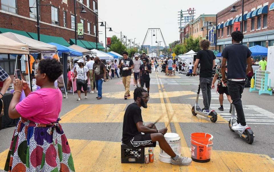 Ed “Bucketman” Humes plays his buckets on 18th Street during Kansas City’s Juneteenth Heritage Festival in the 18th and Vine Jazz District Saturday, June 19, 2021.