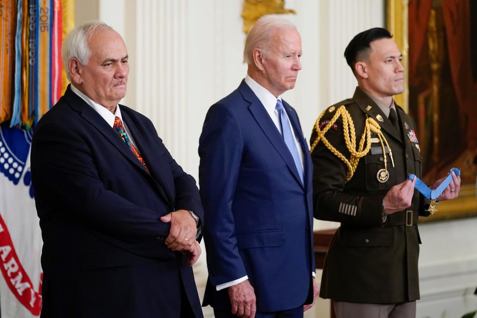 President Joe Biden stands Tuesday with Spc. Five Dwight W. Birdwell, left, before awarding the Medal of Honor to Birdwell for his actions on Jan. 31, 1968, during the Vietnam War.