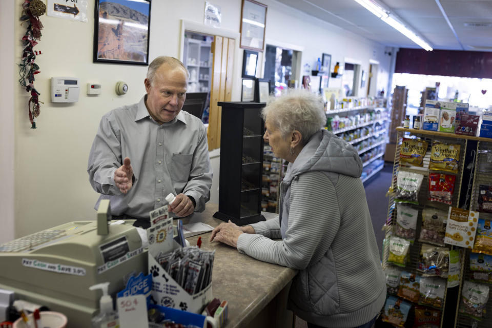 Craig Jones helps a patient at Basin Pharmacy in Basin, Wyo., on Wednesday, Feb. 21, 2024. (AP Photo/Mike Clark)