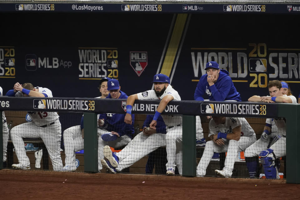 Members of the Los Angeles Dodgers watch during the seventh inning in Game 2 of the baseball World Series against the Tampa Bay Rays Wednesday, Oct. 21, 2020, in Arlington, Texas. (AP Photo/Tony Gutierrez)