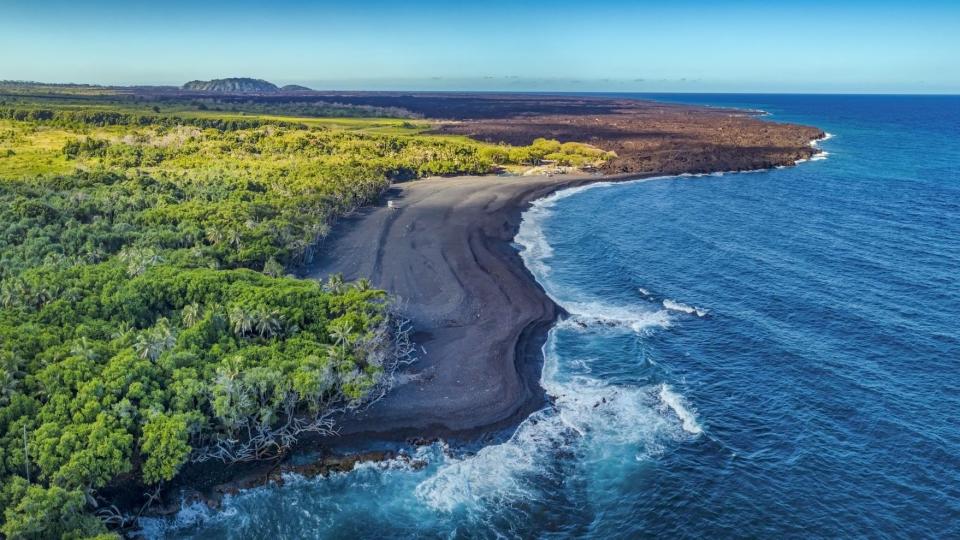 <p>Also known as Isaac Hale Beach Park, the <a href="https://www.gohawaii.com/islands/hawaii-big-island/things-to-do/beaches/pohoiki-beach" rel="nofollow noopener" target="_blank" data-ylk="slk:Big Island's Pohoiki;elm:context_link;itc:0;sec:content-canvas" class="link ">Big Island's Pohoiki</a> black sand beach was formed after the Kilauea volcano erupted in 2018, and hot lava poured into the ocean. Enjoy this lush, pristine setting while you still can: The tides may wash away the dark sand in a few years.</p>