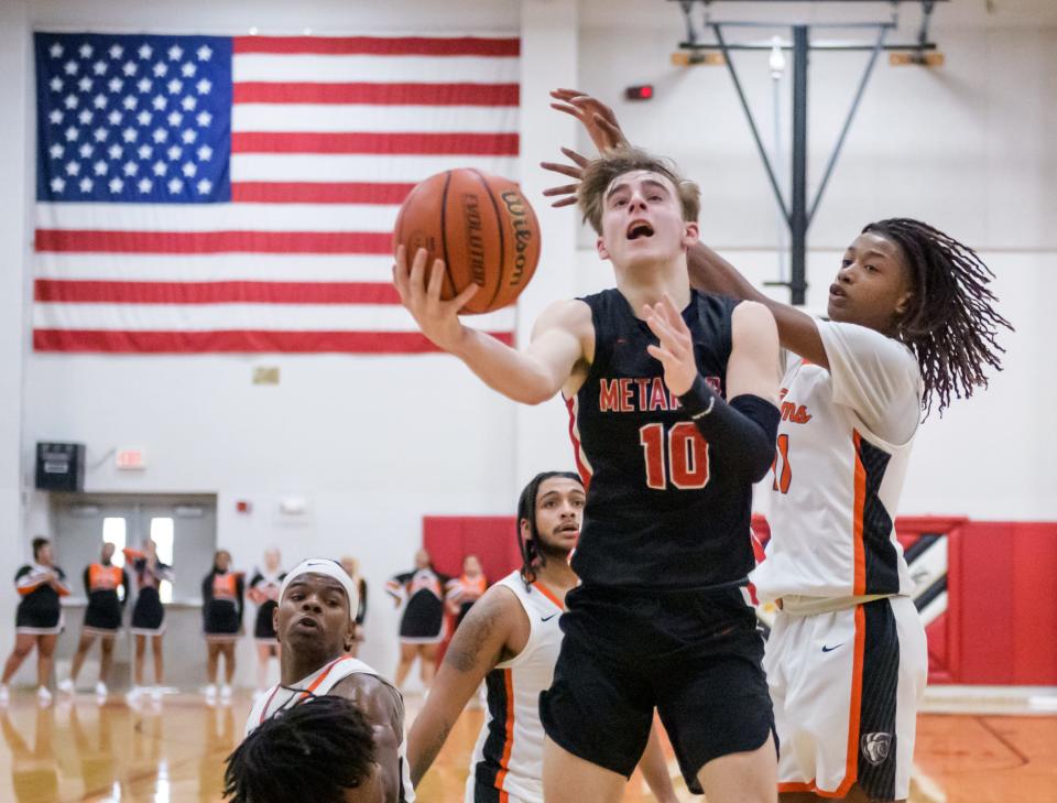 Metamora's Tyler Mason makes a move to the basket against Manual in the second half Saturday, Jan. 21, 2023 in Metamora. The Redbirds defeated the Rams 58-40.