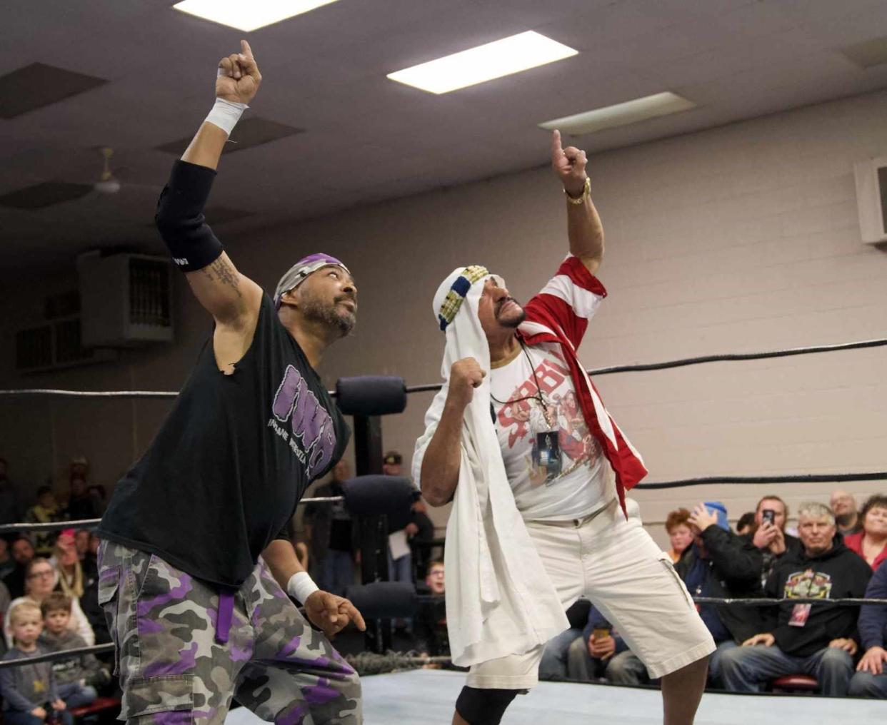 The Most Dangerous Man in Michigan The DBA Malcom Monroe II, left, celebrates with pro wrestling legend Sabu in the ring at IWR 24-The Fall Brawl.