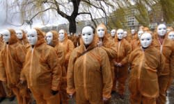 <b>Amnesty International members protest reported abuses of detainees at the hands of U.S. military at Guantanamo Bay, Cuba, in Paris in January 2007.</b> Stephane de Sakutin/<a class="link " href="http://www.gettyimages.com" rel="nofollow noopener" target="_blank" data-ylk="slk:Getty Images;elm:context_link;itc:0;sec:content-canvas">Getty Images</a>