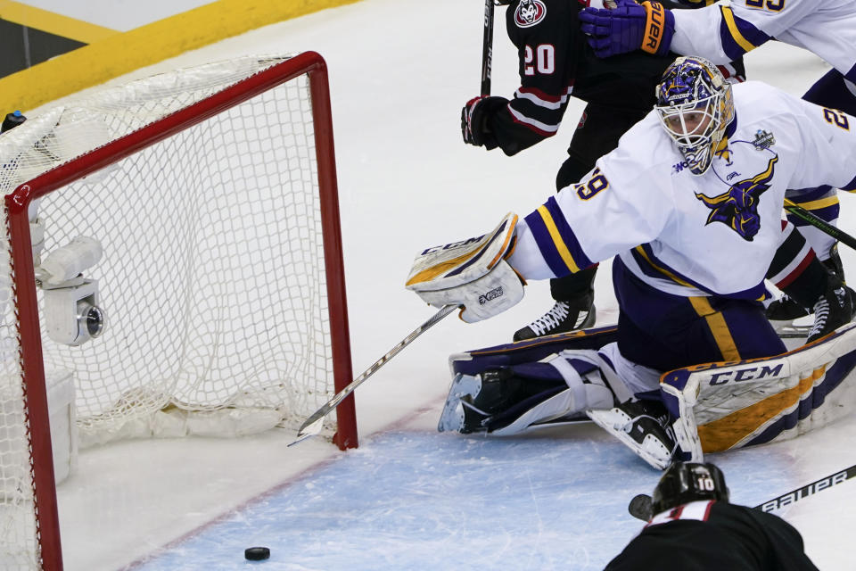 Minnesota State goaltender Dryden McKay (29) can't stop a shot by St. Cloud State's Kyler Kupka (10) that gets by for a goal during the first period of an NCAA hockey semifinal game at the Frozen Four in Pittsburgh, Thursday, April 8, 2021. (AP Photo/Keith Srakocic)