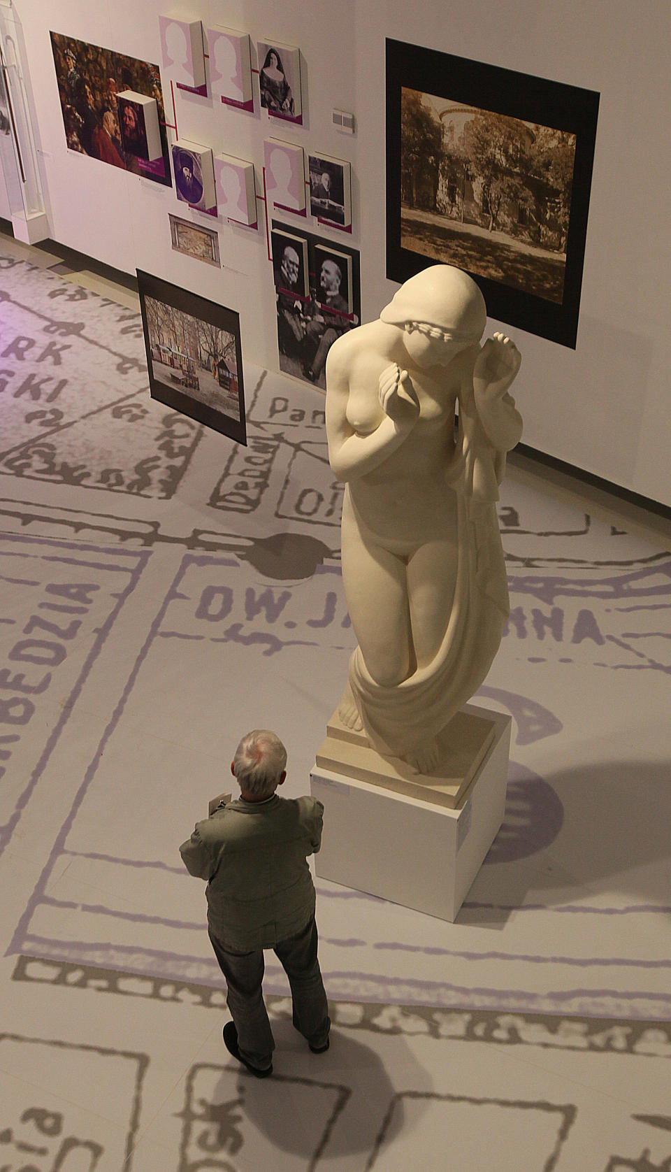 Visitor stands at a new exhibition by the Museum of the History of Polish Jews, in Warsaw, Poland, on Thursday, March 27, 2014. The exhibition that will run through June 30 documents Jewish life in Warsaw before the Holocaust. (AP Photo/Czarek Sokolowski)