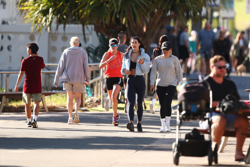 People walk at Burleigh Heads in Gold Coast, Australia. 