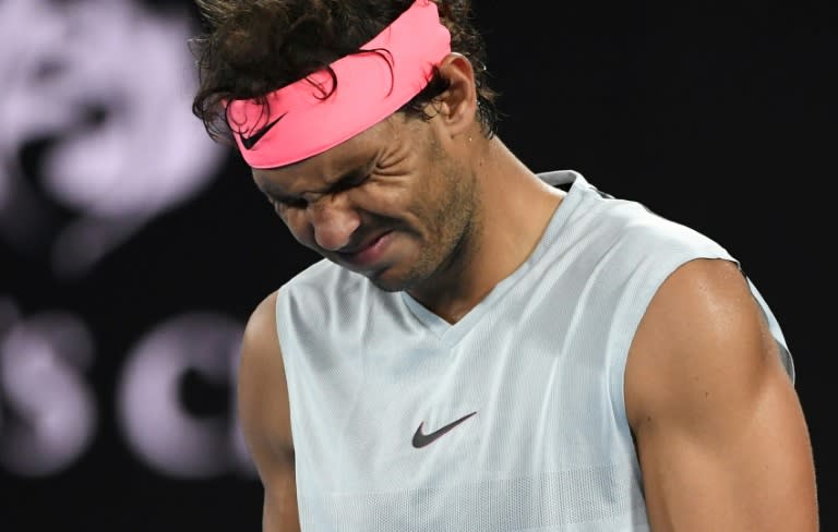 Spain's Rafael Nadal grimaces after injuring his leg in his Australian Open quarter-final match against Marin Cilic