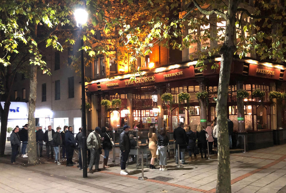 File photo dated 04/11/20 of people queuing to get into the The George pub in Wanstead, east London. Pub landlords could be allowed to require customers to provide proof they are vaccinated against coronavirus, according to Boris Johnson. Issue date: Wednesday March 24, 2021.