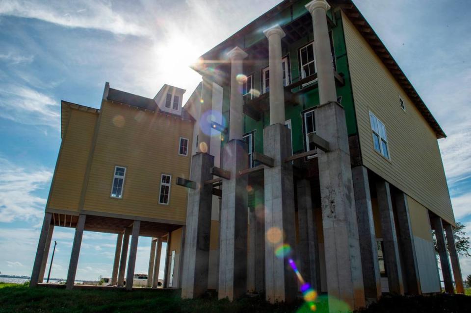 Two homes built as a part of The Sands development in Ocean Springs on Thursday, Oct. 14, 2021.