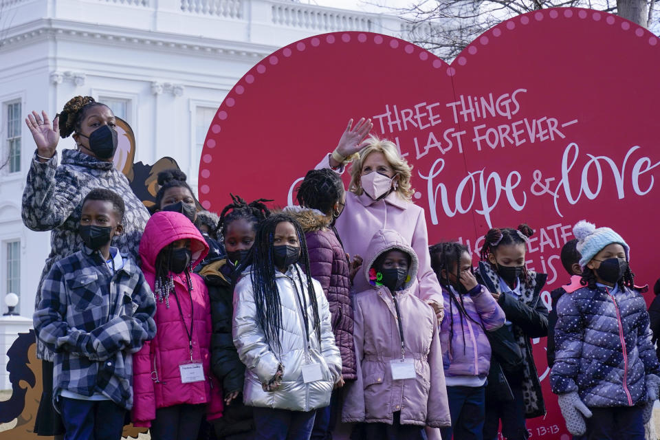 First lady Jill Biden poses for a photo with Aiton Elementary School students and staff as she welcomes school children to the White House in Washington, Monday, Feb. 14, 2022, to celebrate Valentine's Day. (AP Photo/Susan Walsh)