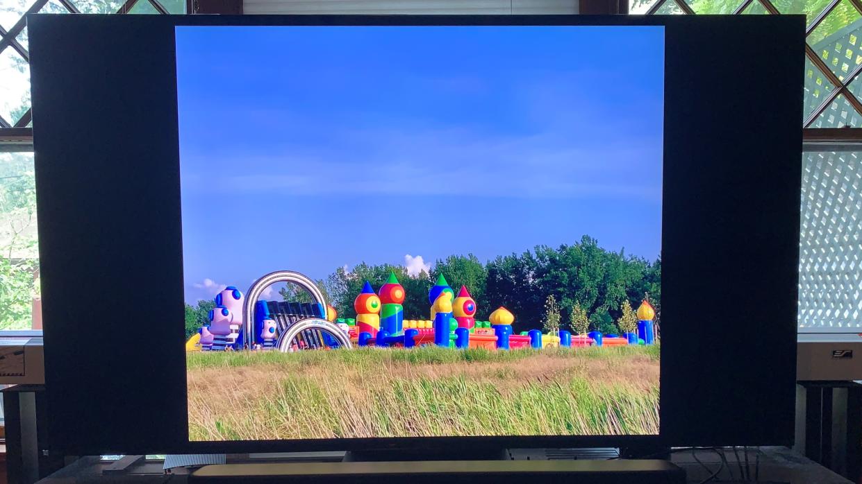  How to Airplay photos to a TV: image of a balloon house against background of trees shown on a TV 