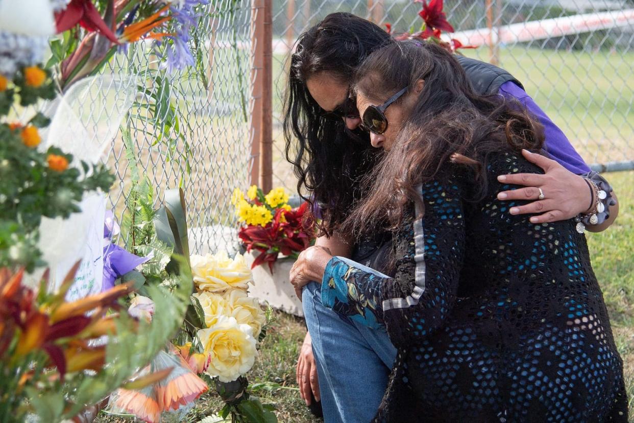 Image: Bouquets of flowers are placed on the waterfront near White Island Tours base in Bay of Plenty