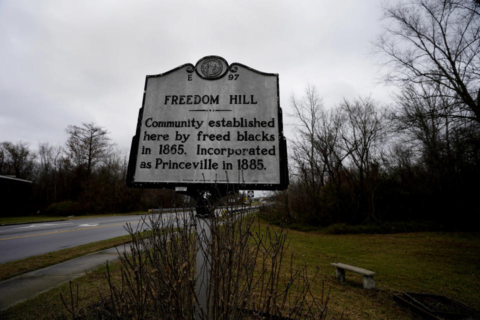 A historical marker is displayed at the site of Freedom Hill in Princeville, N.C., Thursday, March 10, 2022. Historic Princeville, on the banks of the Tar River in eastern North Carolina, is one hurricane away from disaster. The town, whose seal proudly declares it “the oldest town chartered by Blacks in America," has flooded many times.(AP Photo/Gerry Broome)