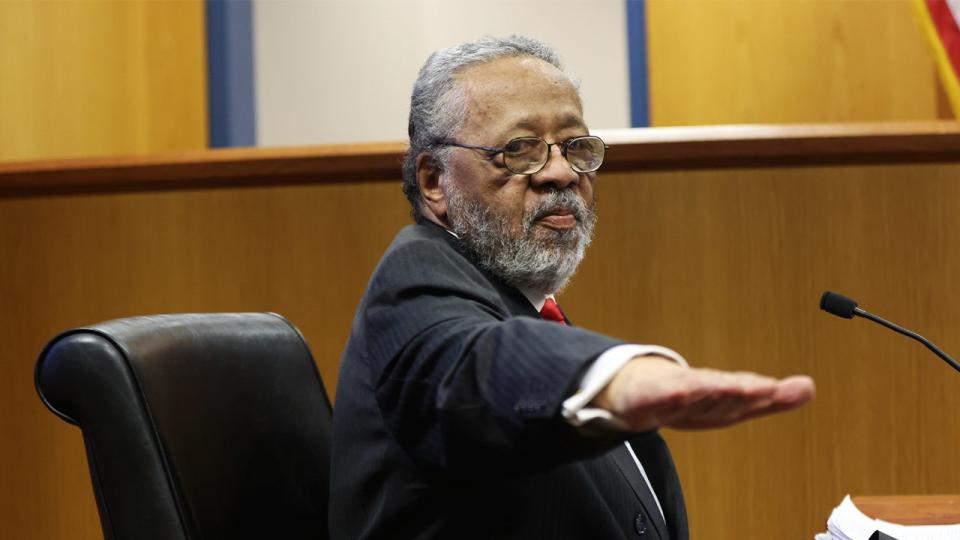 John Floyd III, father of Fulton District Attorney Fani Willis, left, testifes at the Fulton County Courthouse in Atlanta, Georgia, US, on Friday, Feb. 16, 2024.