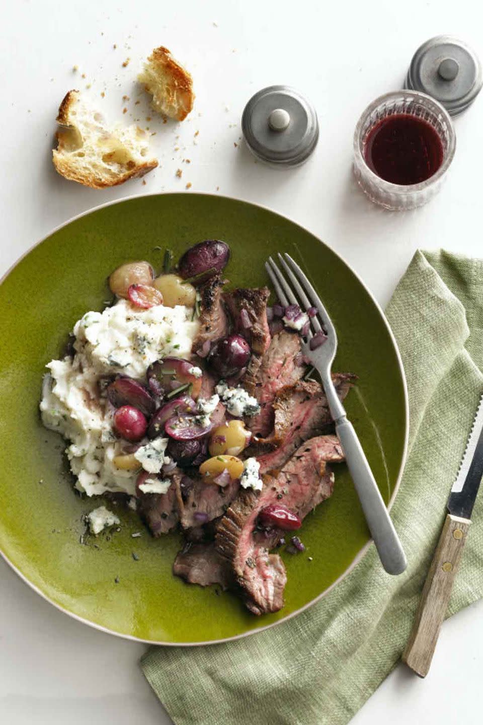 Herb-Garlic Crusted Flank Steak with Pan-Roasted Grapes