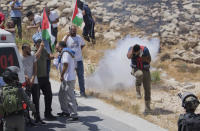 FILE - In this Aug. 16. 2019, file photo, Israeli border police disperse Palestinian, Israeli and foreign activists during a rally protesting a newly established settlement near the West Bank village of Kufr Malik, east of Ramallah. As President Donald Trump presented a Mideast plan favorable to Israel, Prime Minister Benjamin Netanyahu on Tuesday, Jan. 28, announced plans to move ahead with the potentially explosive annexation of large parts of the occupied West Bank, including dozens of Jewish settlements. (AP Photo/Nasser Nasser, File)