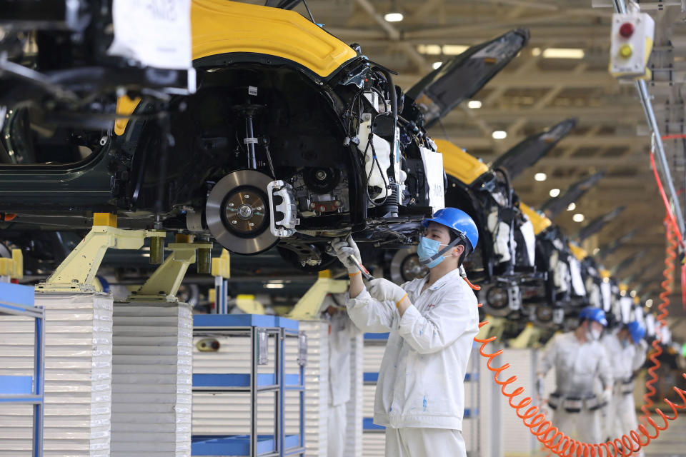 Image: An employee working on an assembly line at an auto plant of Dongfeng Honda in Wuhan in China's central Hubei province (AFP - Getty Images)