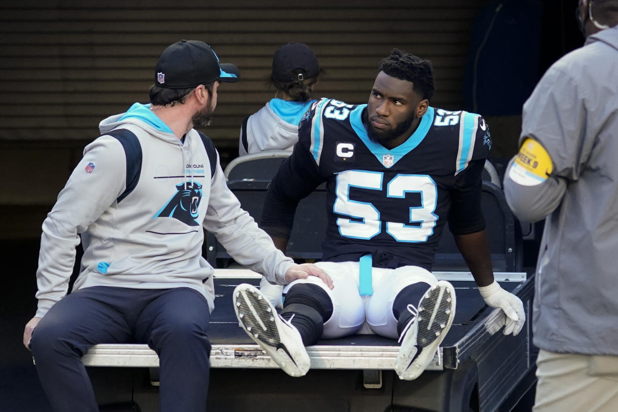 Carolina Panthers defensive end Brian Burns had his ankle twisted by Patriots QB Mac Jones on Sunday. (AP Photo/John Bazemore)