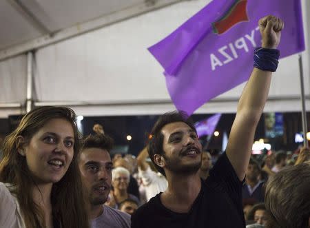 Supporters of leftist Syriza party react at the party's main election kiosk after seeing the results following a general election in Athens, Greece, September 20, 2015. REUTERS/Dimitris Michalakis
